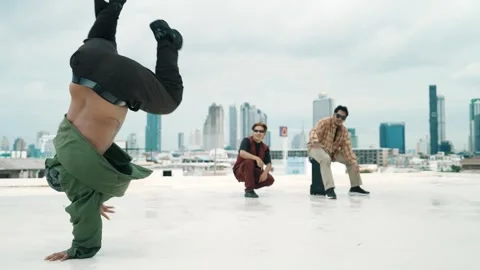 Profession break dancer practice B-boy dance with friends at roof top. hiphop. Stock Footage 274842640
