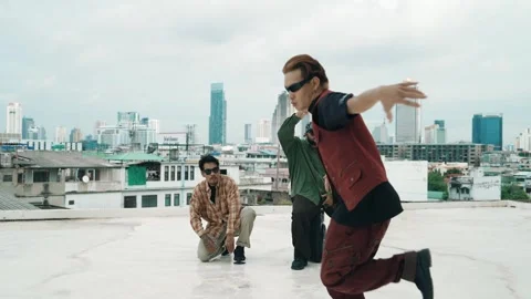 Profession break dancer practice B-boy dance with friends at roof top. hiphop. Stock Footage 274842666