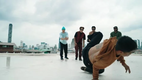 Profession break dancer practice B-boy dance with friends at roof top. hiphop. Stock Footage 275196918