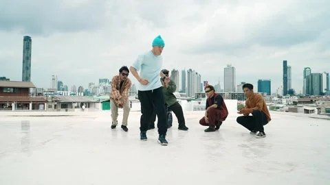 Profession break dancer practice B-boy dance with friends at roof top. hiphop. Stock Footage 275719710