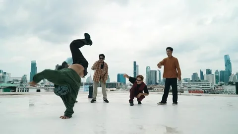 Profession break dancer practice B-boy dance with friends at roof top. hiphop. Stock-Footage 275847404
