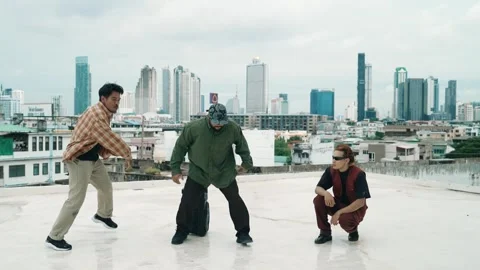 Profession break dancer practice B-boy dance with friends at roof top. hiphop. Stock-Footage 275847479