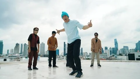 Profession break dancer practice B-boy dance with friends at roof top. Endeavor. 写真素材