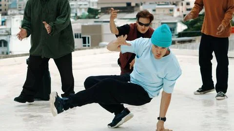 Profession break dancer practice B-boy dance with friends at roof top. Endeavor. 写真素材