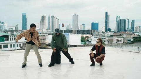 Profession break dancer practice B-boy dance with friends at roof top. Endeavor. 写真素材