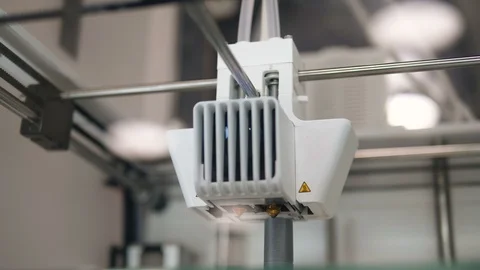 Professional 3D printer with white tool head prints tube Stock Footage 120026194