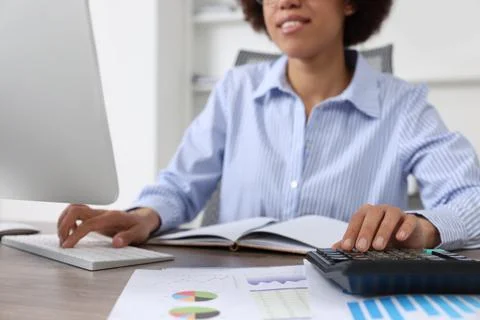 Professional accountant working on computer in office, closeup Stock Photos