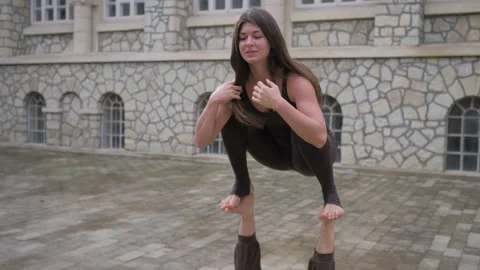 Professional acrobatic yoga. couple practising acro exercises on mat outdoors Stock Footage 150660745