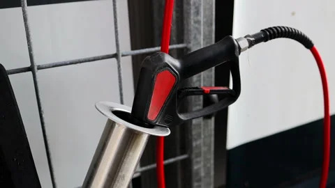 Professional active foam gun with red hose in metal holder at self-service car w Stock Footage 339583372