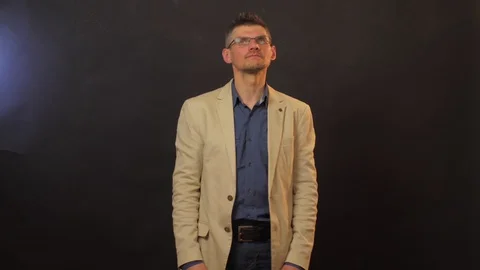 Professional actor in glasses plays role of serious guy Stock Footage 129304866