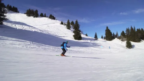 Professional advanced skier skiing on slopes in the Swiss alps Stock Footage 137616678