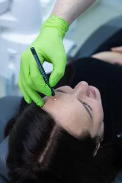 Professional Aesthetic Procedure in Progress: Close-Up of Technician Marking Stock Photos