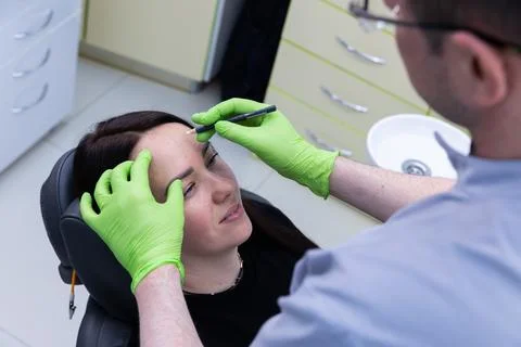 A Professional Aesthetic Procedure in Progress: Enhancing Beauty with Precision Stock Photos