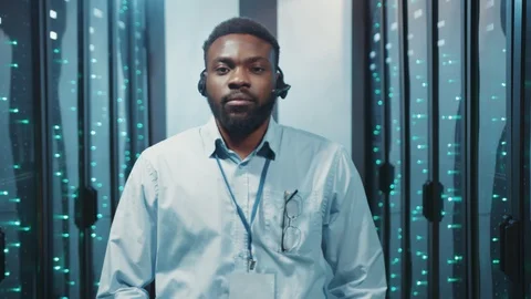Professional afro-american server technician with arms crossed standing in Stock Footage 119081561