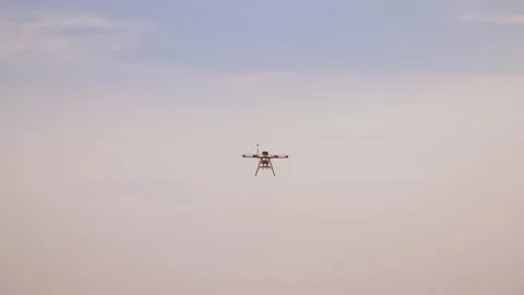 Professional agricultural multi-rotor drone flying in the sky Video stock 332910080