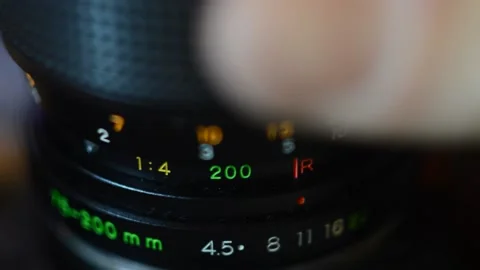 Professional analog camera lens setting. man set the analog reflex lens. Video stock 234873104