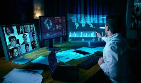 Professional analyzing global data on futuristic virtual screens during video 스톡 사진
