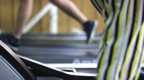 Professional and beginner bodybuilders running on a treadmill in gym. Stock Footage 37232520