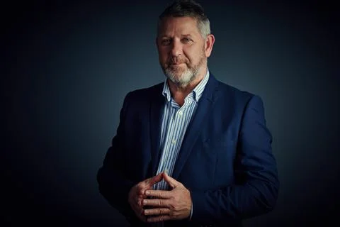 Professional and presentable. Studio portrait of a mature businessman posing Stock Photos
