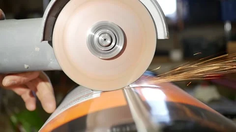 Professional angle grinder grinding metal canister. DYI recycling projet for the Stock Footage 143573096