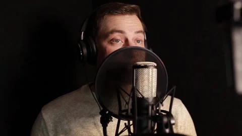 A professional announcer makes a recording in the studio Stock Footage 145185370