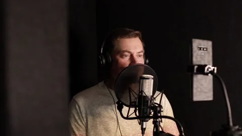 A professional announcer makes a recording in the studio Stock Footage 145185476