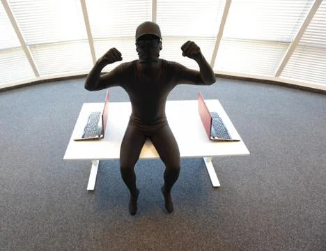 Professional anonymous hacker with laptops ready to hack - portrait Stock Photos