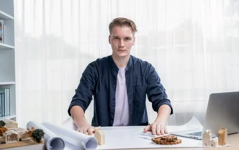 Professional architect designer sit at desk in office portrait. Iteration Stock Photos