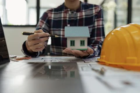 Professional architect designer structural engineer working with blueprint Fotos de archivo