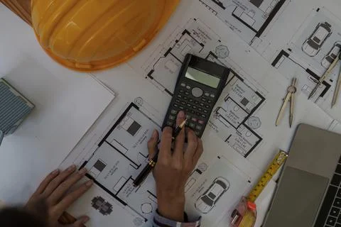 Professional architect designer structural engineer working with blueprint Fotos de archivo