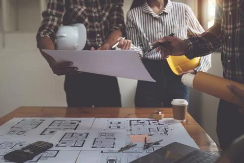 Professional architect designer structural engineer team colleagues discussing Stock Photos