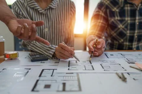 Professional architect designer structural engineer team colleagues discussing Stock Photos