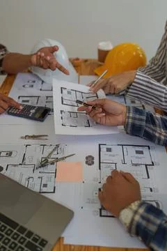 Professional architect designer structural engineer team colleagues discussing Stock Photos