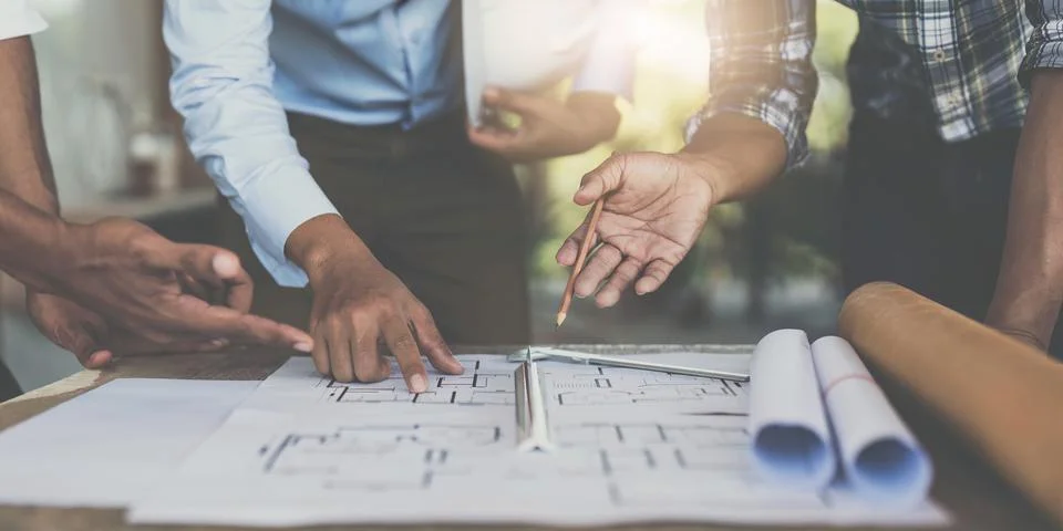 Professional architect designer structural engineer team colleagues discussing Stock Photos