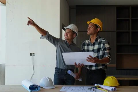 Professional architect designer structural engineer team colleagues discussing Stock Photos