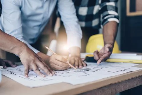 Professional architect designer structural engineer team colleagues discussing Stock Photos