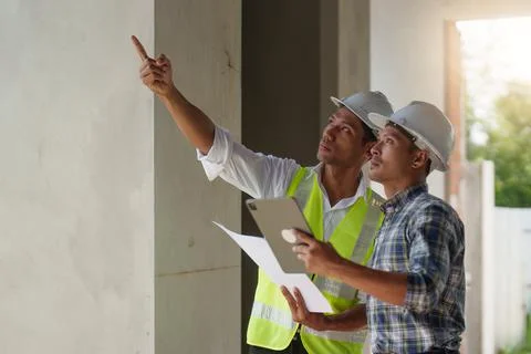 Professional architect designer structural engineer team colleagues discussing Stock Photos