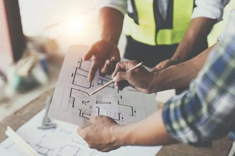 Professional architect designer structural engineer team colleagues discussing Stock Photos