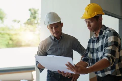 Professional architect designer structural engineer team colleagues discussing Stock Photos