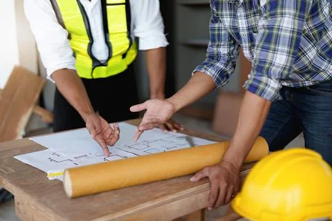 Professional architect designer structural engineer team colleagues discussing Stock Photos