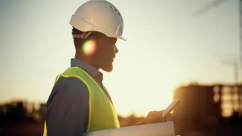 Professional architect or engineer surfing internet by smart home, construction Stock Footage 317806649