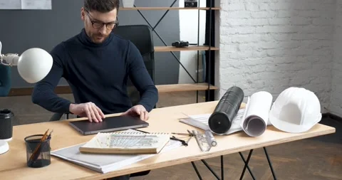 Professional Architect starting to work on Laptop in his Loft stylish Office Stock Footage 145437259