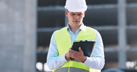 Professional architecture inspector working with digital tablet at construction Stock Footage 139727451