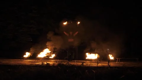 A professional artist demonstrates various fire tricks. A fire show. Stock Footage 295842861