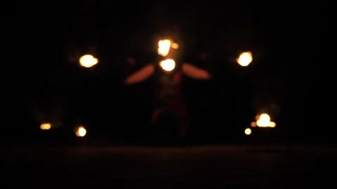A professional artist demonstrates various fire tricks. A fire show. Stock Footage 297353104