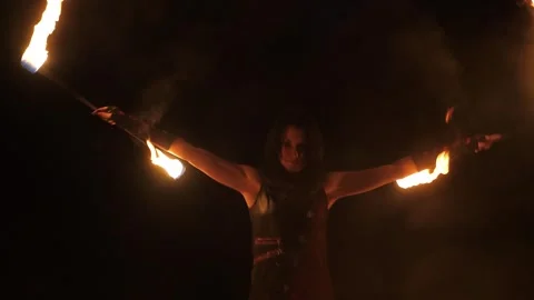A professional artist demonstrates various fire tricks. A fire show. Stock Footage 317298080