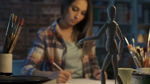 Professional artist drawing in her studio Stock Footage 90371258
