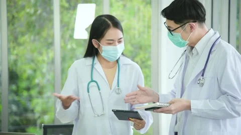Professional Asian doctors discuss about work topic for cure the patient Stock Footage