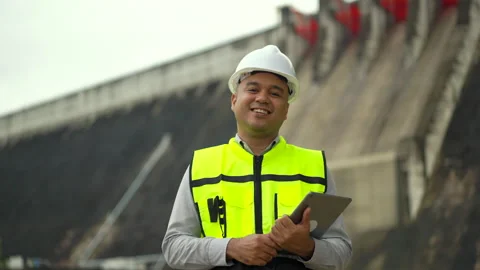 Professional asian maintenance engineer man with safety helmet in construction. Stock Footage 247104854