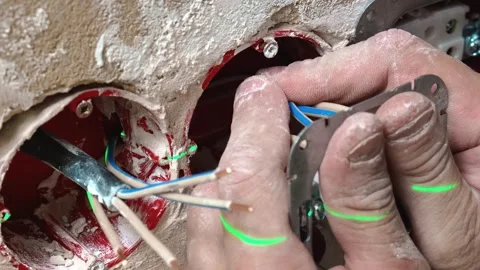 Professional Assembling Wallmounted Switch With Precise Tools And Attention Stock Footage 329498095